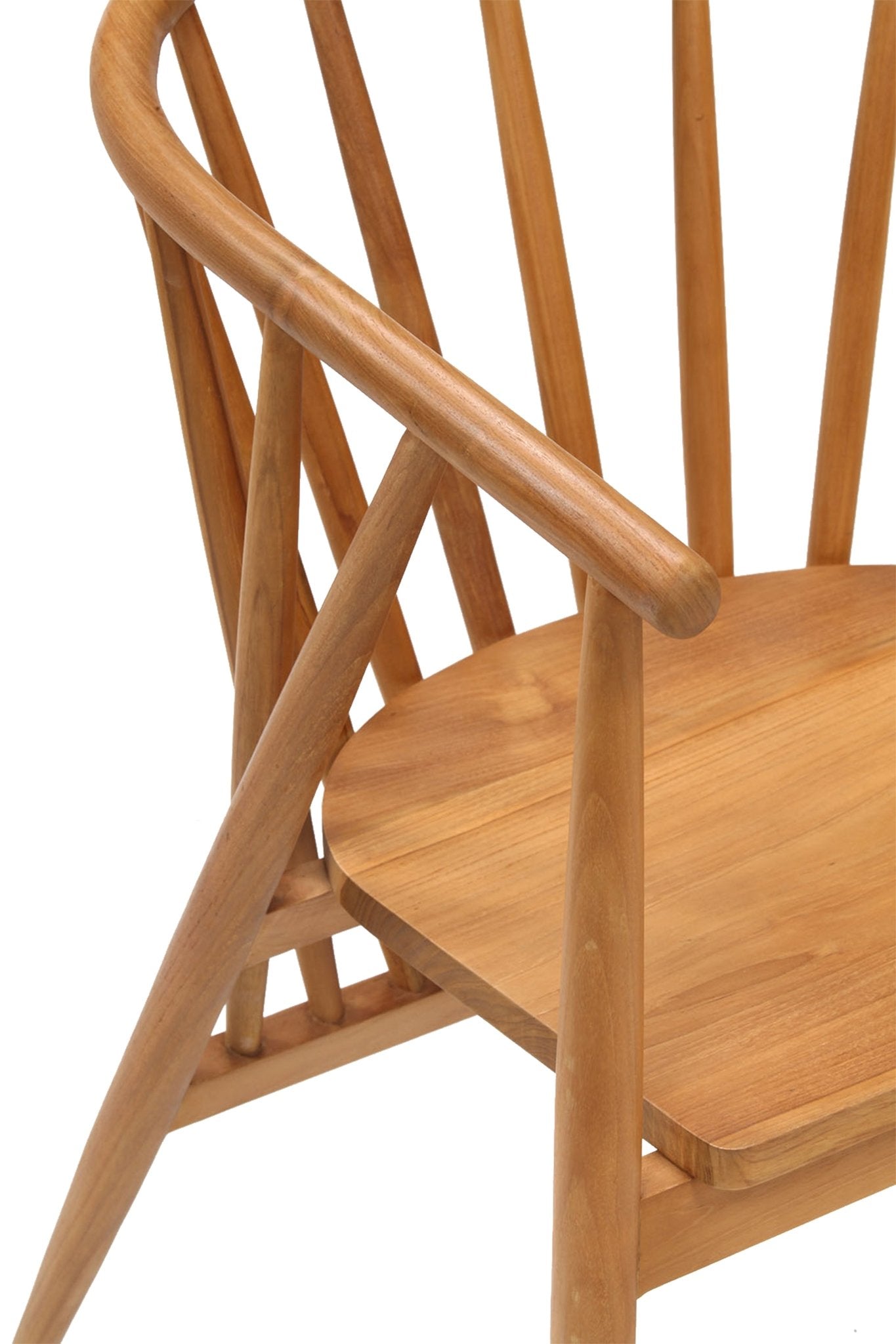 Close-up of a natural teak Shaker dining chair showing the rounded armrest, angled spindle back and smooth solid-wood seat in a warm teak finish.
