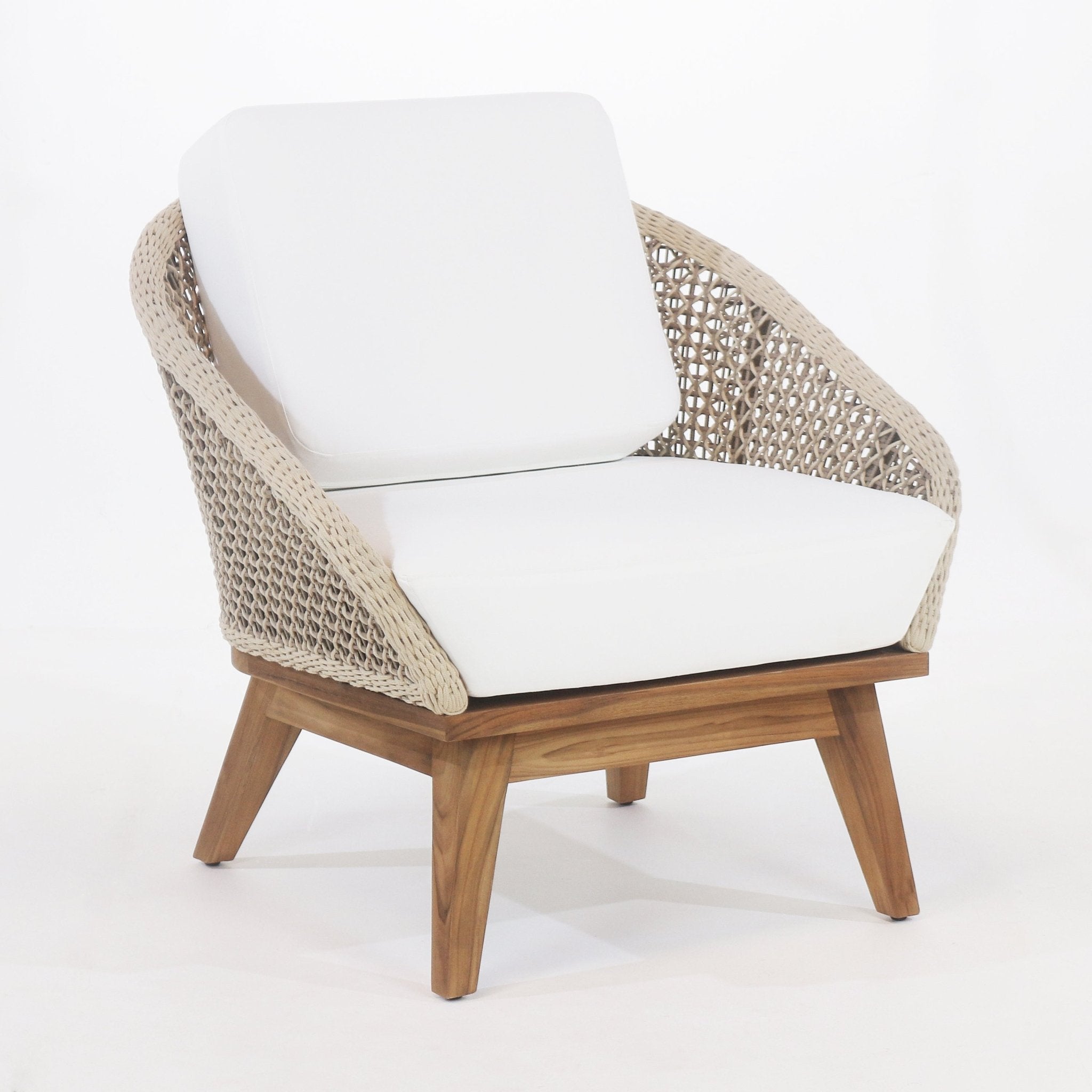 Coastal outdoor accent chair with beige rope-woven back and arms, plush white outdoor fabric seat and back cushions, and a warm teak wood frame with angled legs.