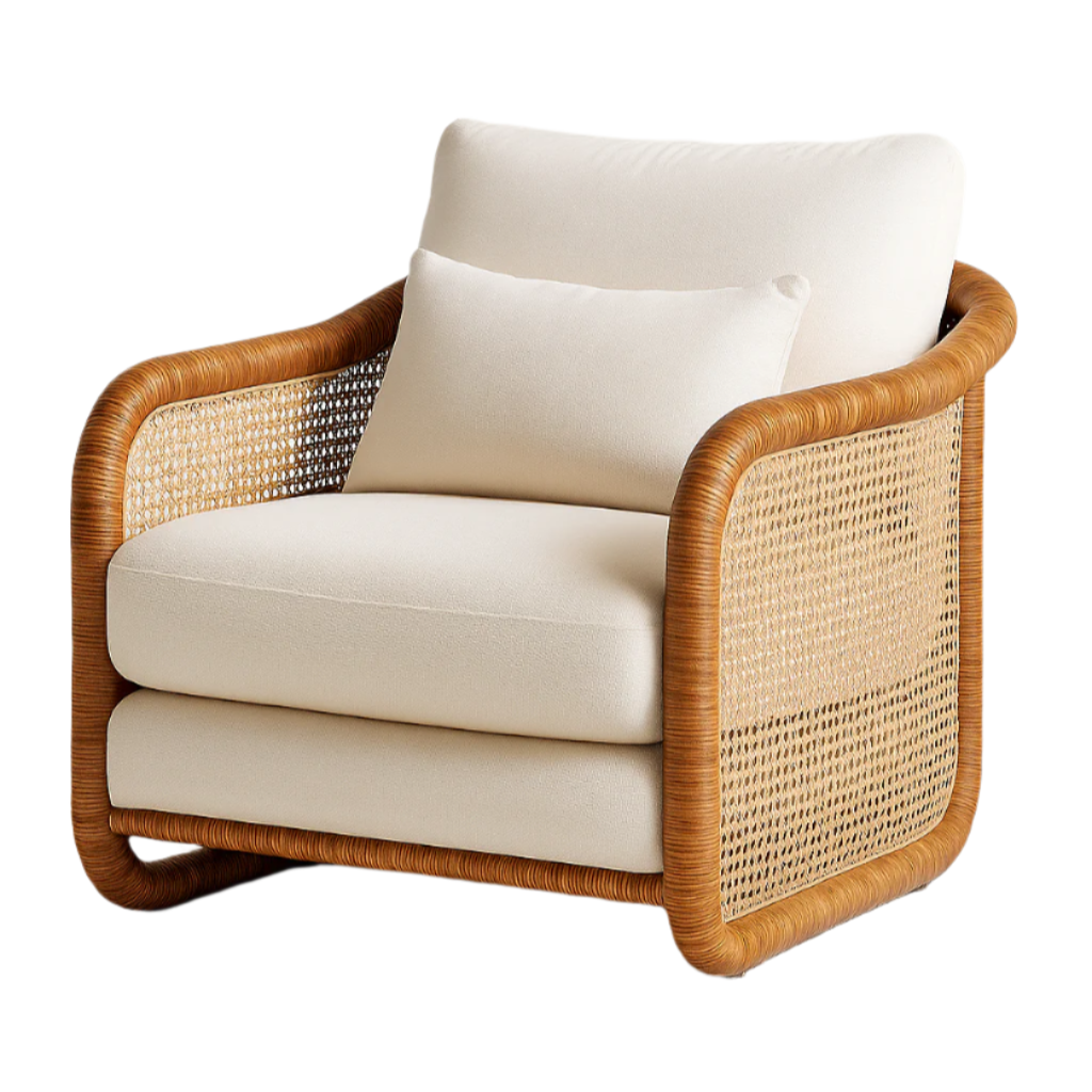 Cream upholstered outdoor accent chair with plush seat cushion and lumbar pillow, enclosed by a rounded honey rattan frame and woven cane side panels