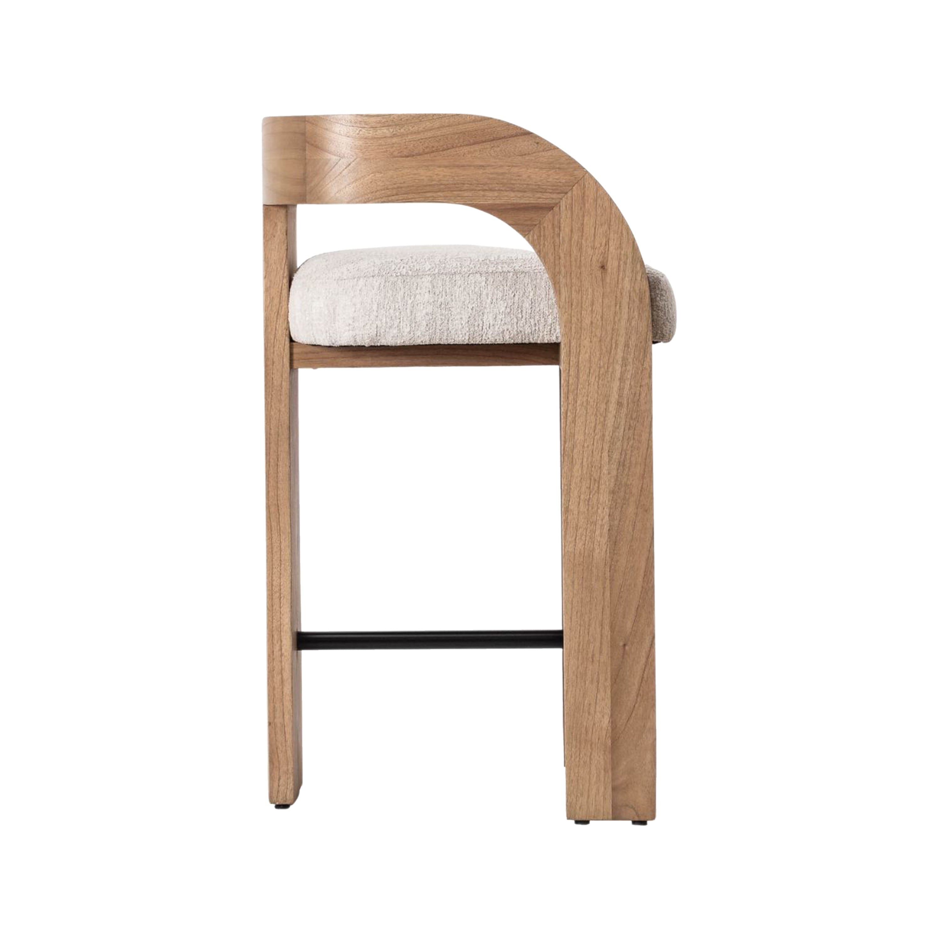 Side view of a counter-height stool with a curved natural wood U-back and armrest, cream upholstered fabric seat, and a slim black metal footrest against a white background.
