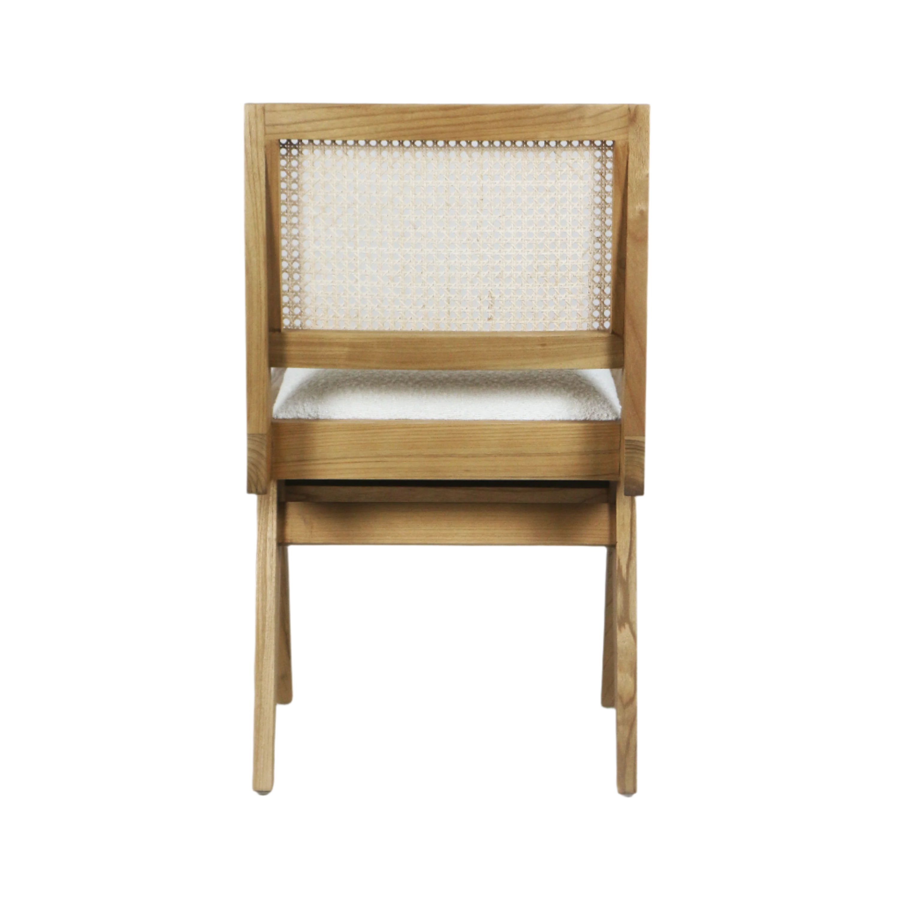 Rear view of an armless dining chair with a natural ash wood frame, woven cane backrest and cream boucle upholstered seat shown on a white background.