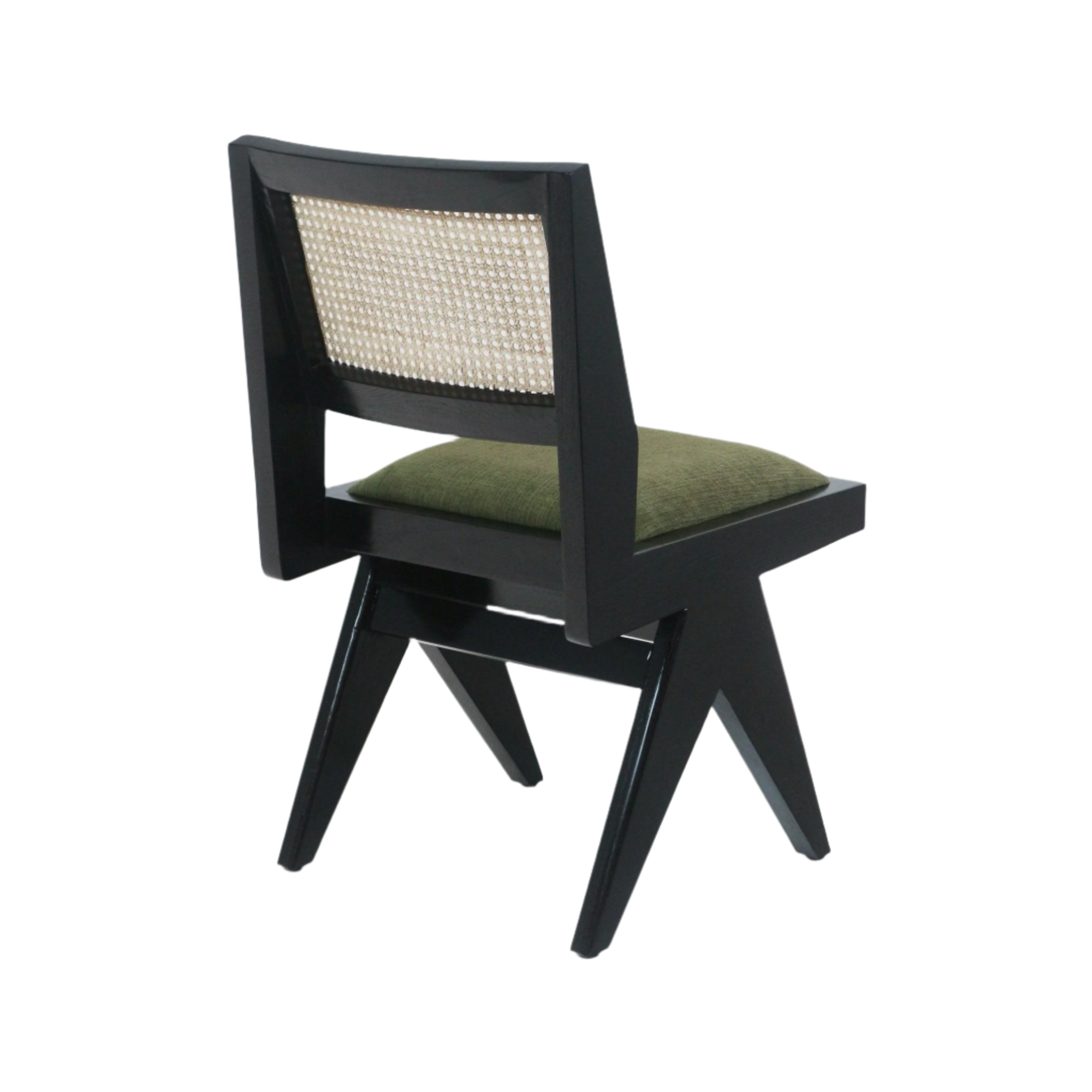 Rear three-quarter view of a mid-century modern armless dining chair with a black solid wood frame, natural woven cane back panel, angled legs and a green fabric-upholstered seat cushion.