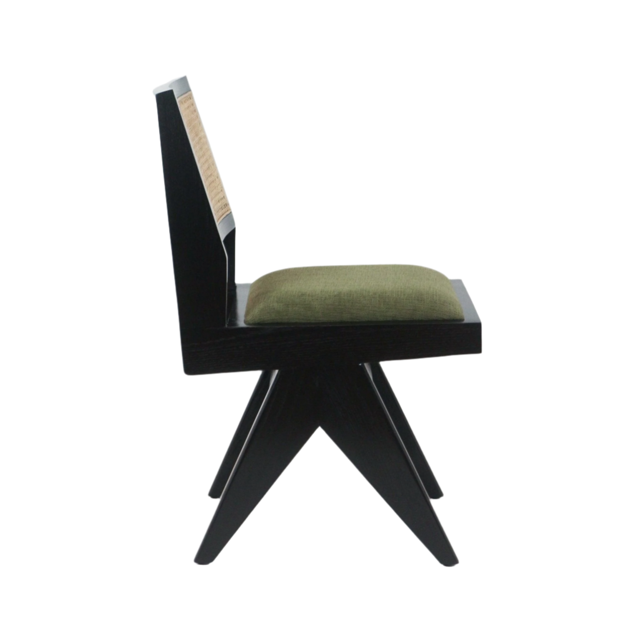 Side profile of an armless mid-century modern dining chair with a black solid wood frame, X-shaped splayed legs, natural cane back panel and a green upholstered seat cushion on a white background.