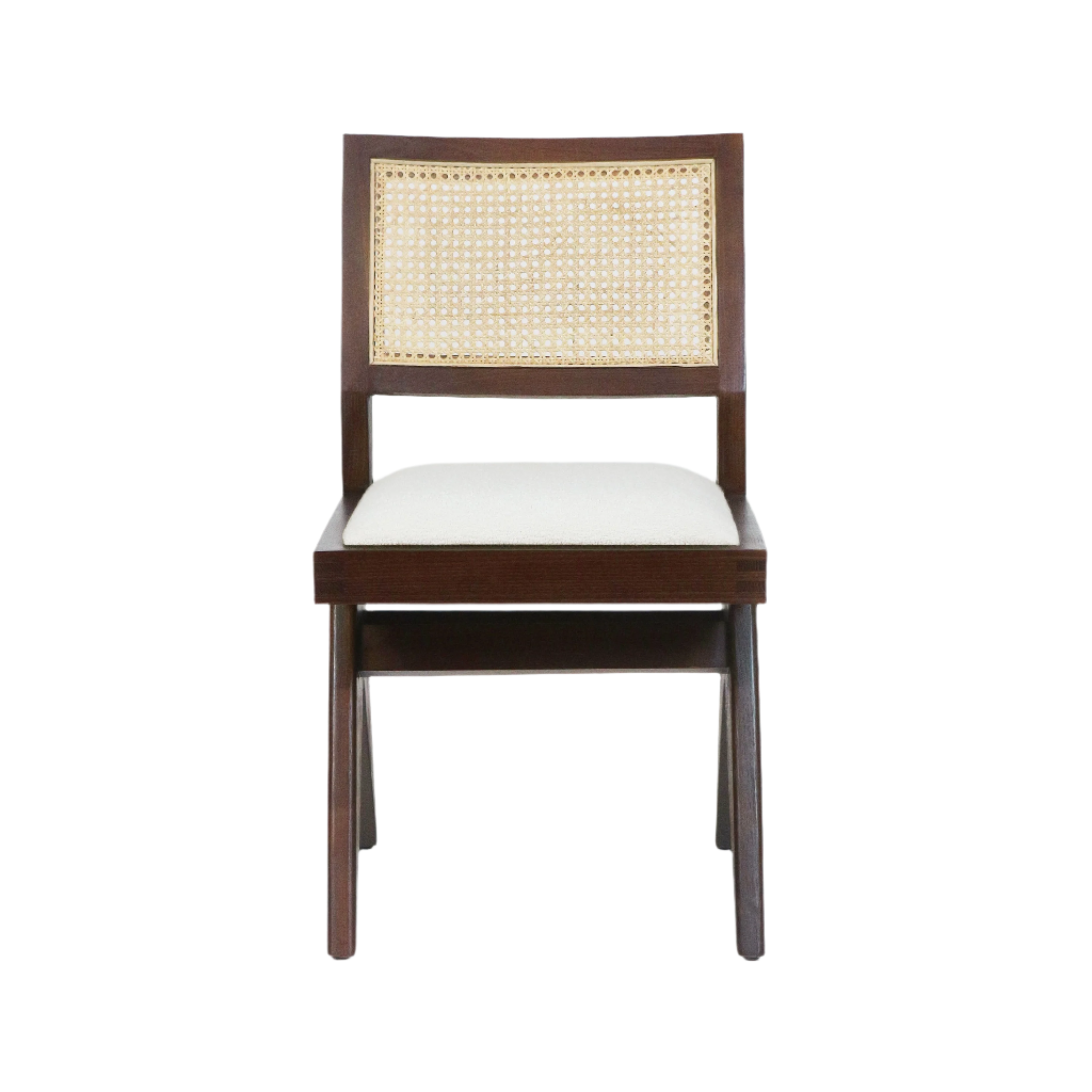 Front-facing mid-century modern armless dining chair with medium-brown solid wood frame, woven natural cane back and cream upholstered seat cushion on a white background.