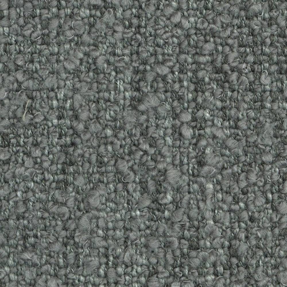 Close-up of textured boucle upholstery fabric in muted grey showing looped wool-acrylic fibers (24% wool, 66% acrylic, 10% polyester), ideal for contemporary sofa upholstery.