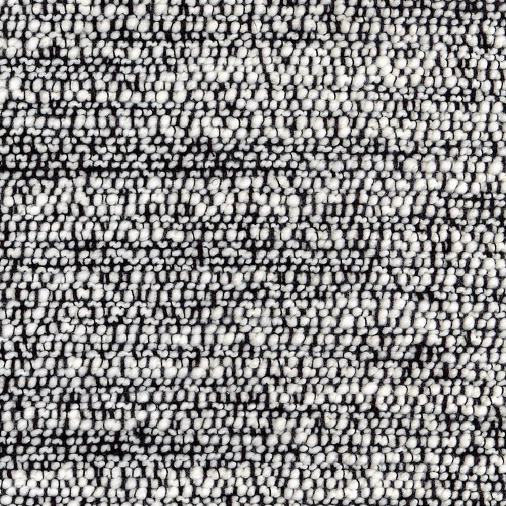 Close-up of black-and-white boucle upholstery fabric showing dense looped texture in a wool-blend (20% wool with acrylic, linen, rayon and polyester), ideal for contemporary modern sofas.