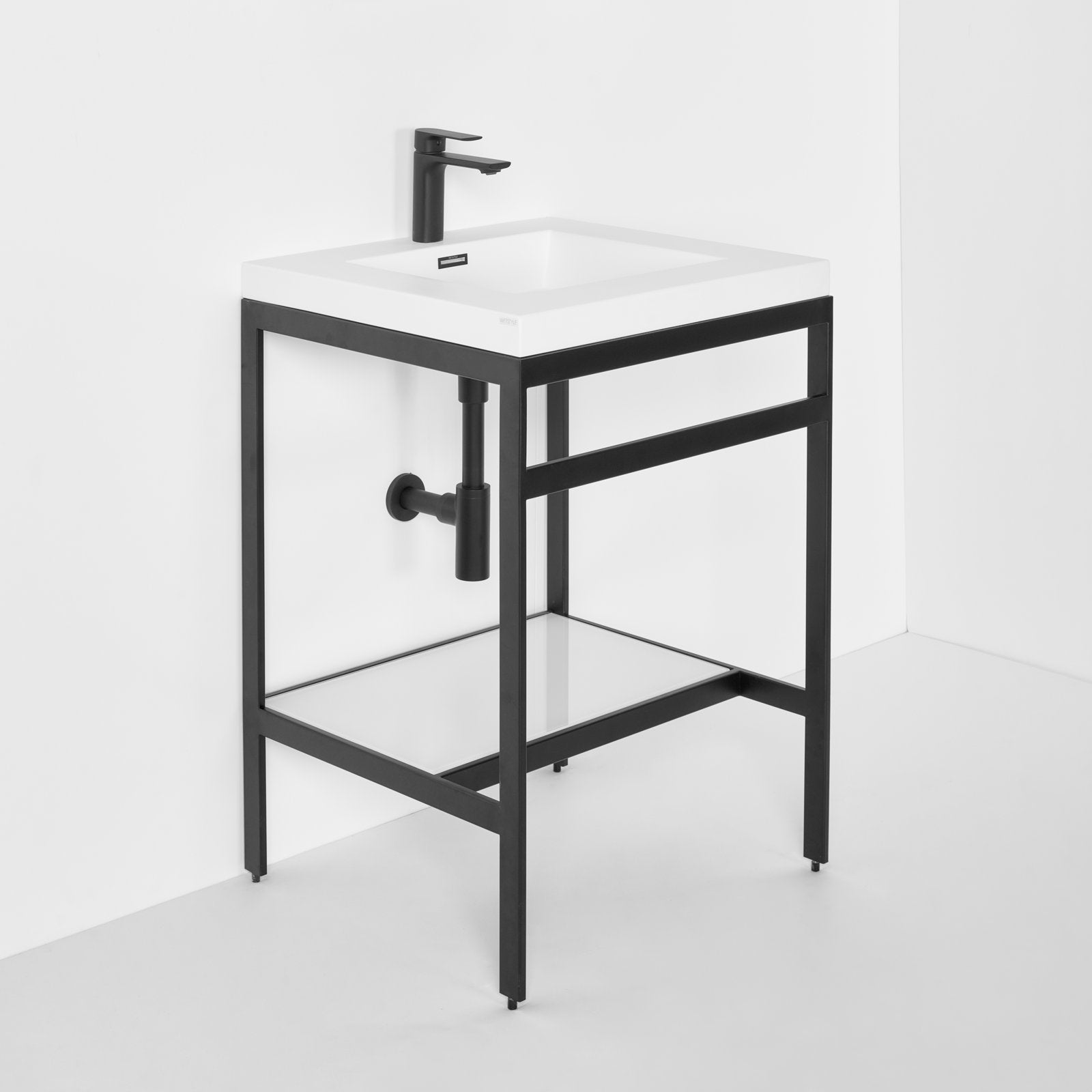 Freestanding 24.25-inch modern single-sink bathroom vanity with a white stone top and integrated rectangular basin, black open-frame base with glass lower shelf and matte black faucet shown against a white wall.