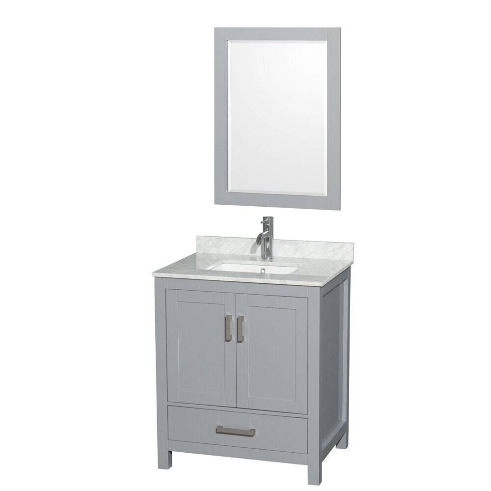 Contemporary gray wooden bathroom vanity with a stone marble top, white undermount ceramic sink, chrome single-handle faucet, two-door cabinet and lower drawer, freestanding and shown with a matching framed mirror.